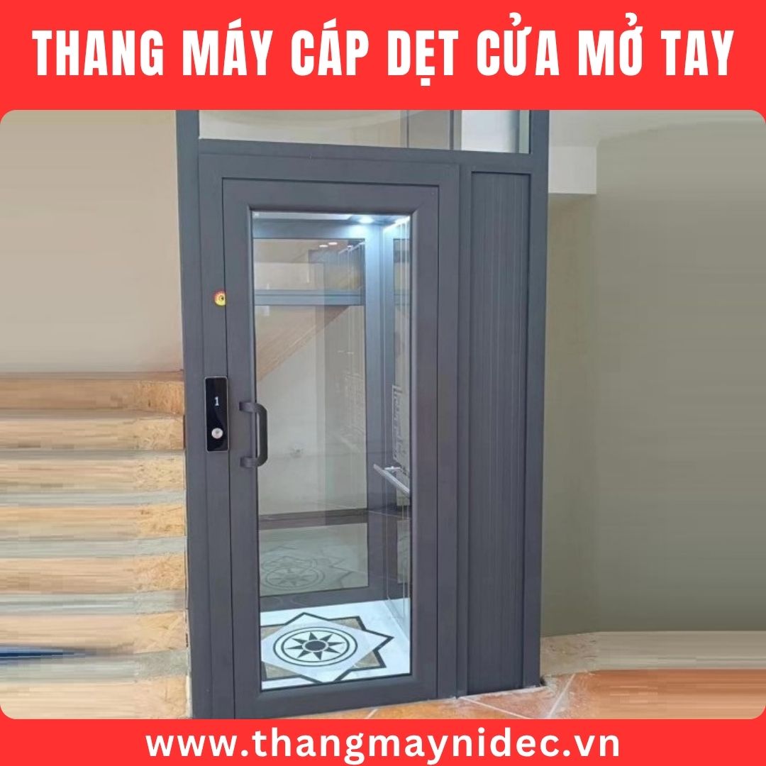 thang máy cáp dẹt cửa mở tay
